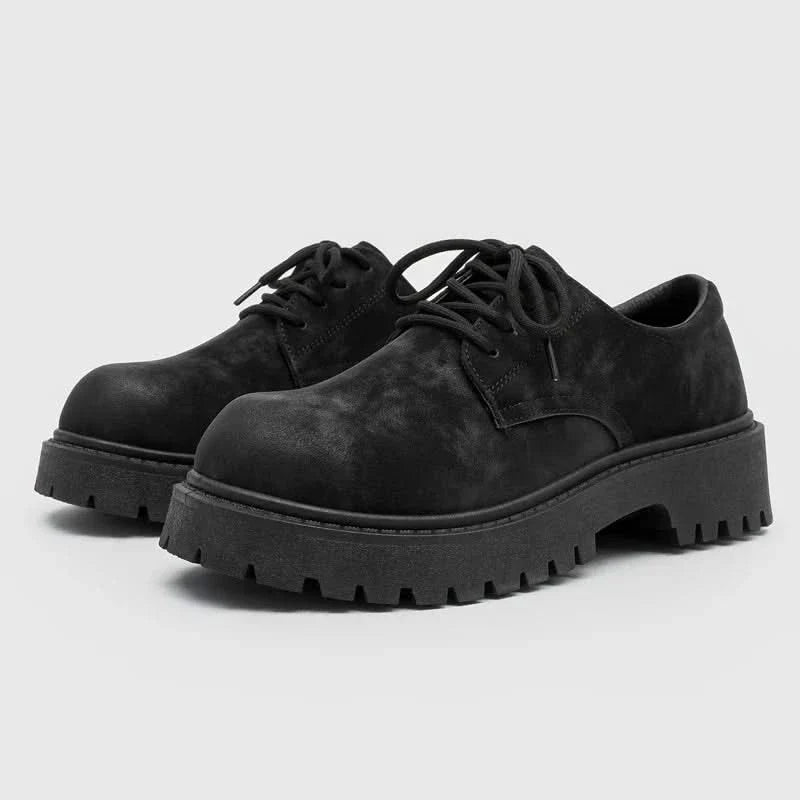 Sleek black men's thick-sole derby shoes, blending comfort with contemporary fashion and durability.