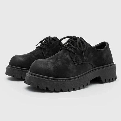 Sleek black men's thick-sole derby shoes, blending comfort with contemporary fashion and durability.