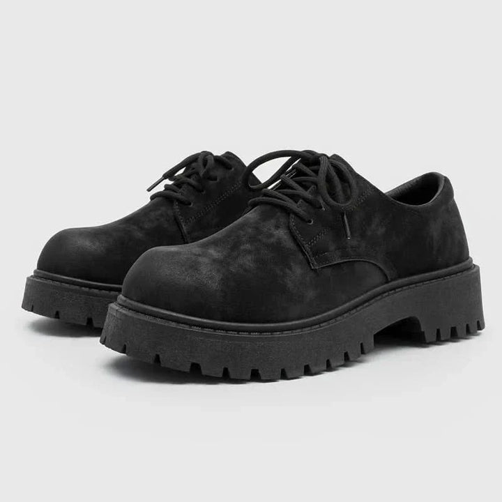 Sleek black men's thick-sole derby shoes, blending comfort with contemporary fashion and durability.