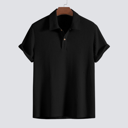 Close-up of the textured men's waffle knit polo shirt fabric, highlighting its softness for casual wear.
