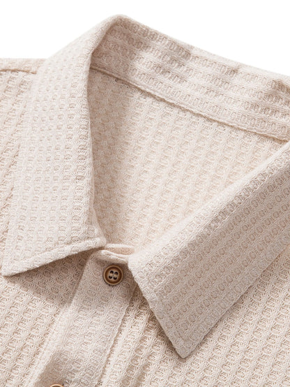 Back view of a men's comfortable waffle knit polo shirt, showcasing its versatile design for smart casual wear.