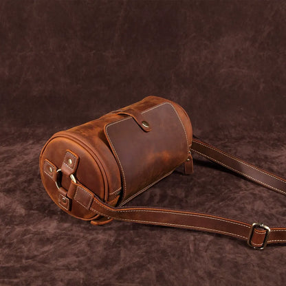Close-up of the rich texture on the Cooper men's genuine leather messenger bag, coffee color.