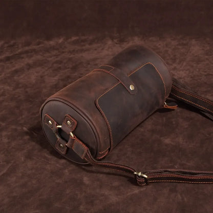 Men's Cooper genuine leather messenger bag, worn crossbody, ideal for urban commutes & travel.