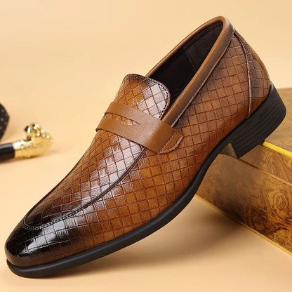 Close-up of classic men's Corté woven slip-on loafers, showcasing intricate texture and quality.