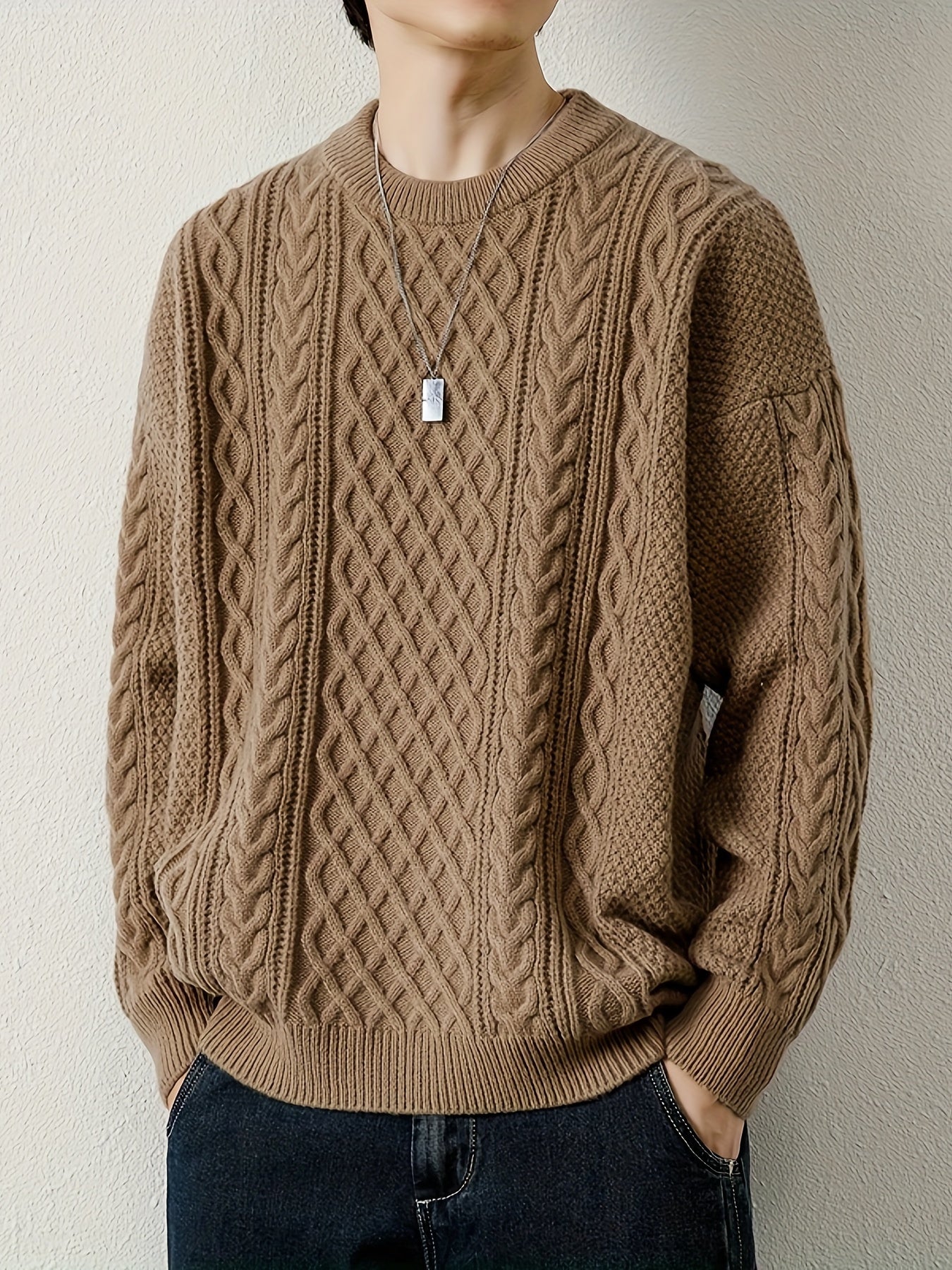 Stylish men's cable knit pullover sweater, ideal for casual winter wear.
