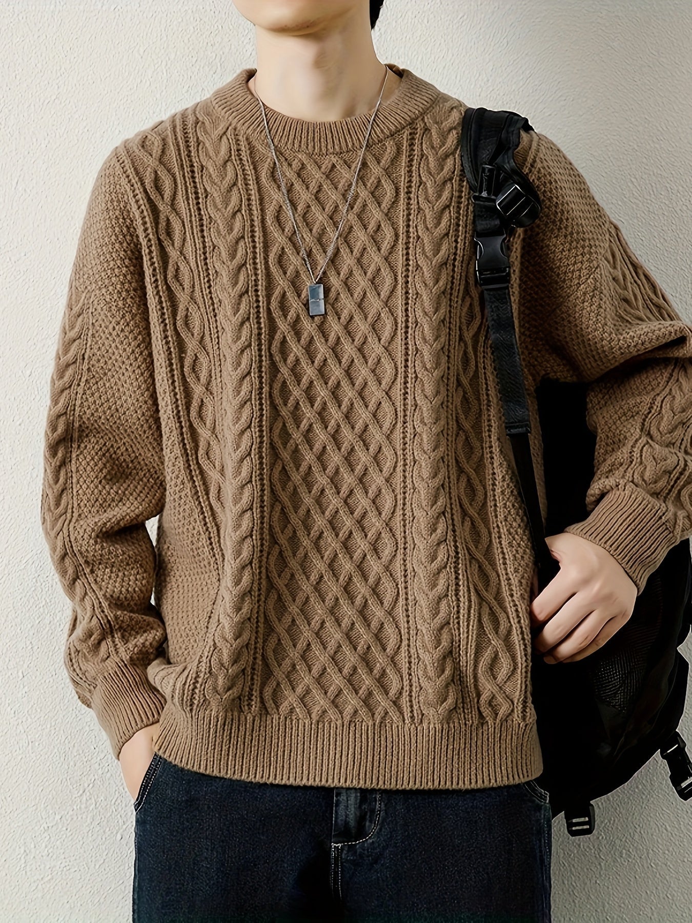 Classic men's chunky cable knit jumper, offering cozy warmth & style.