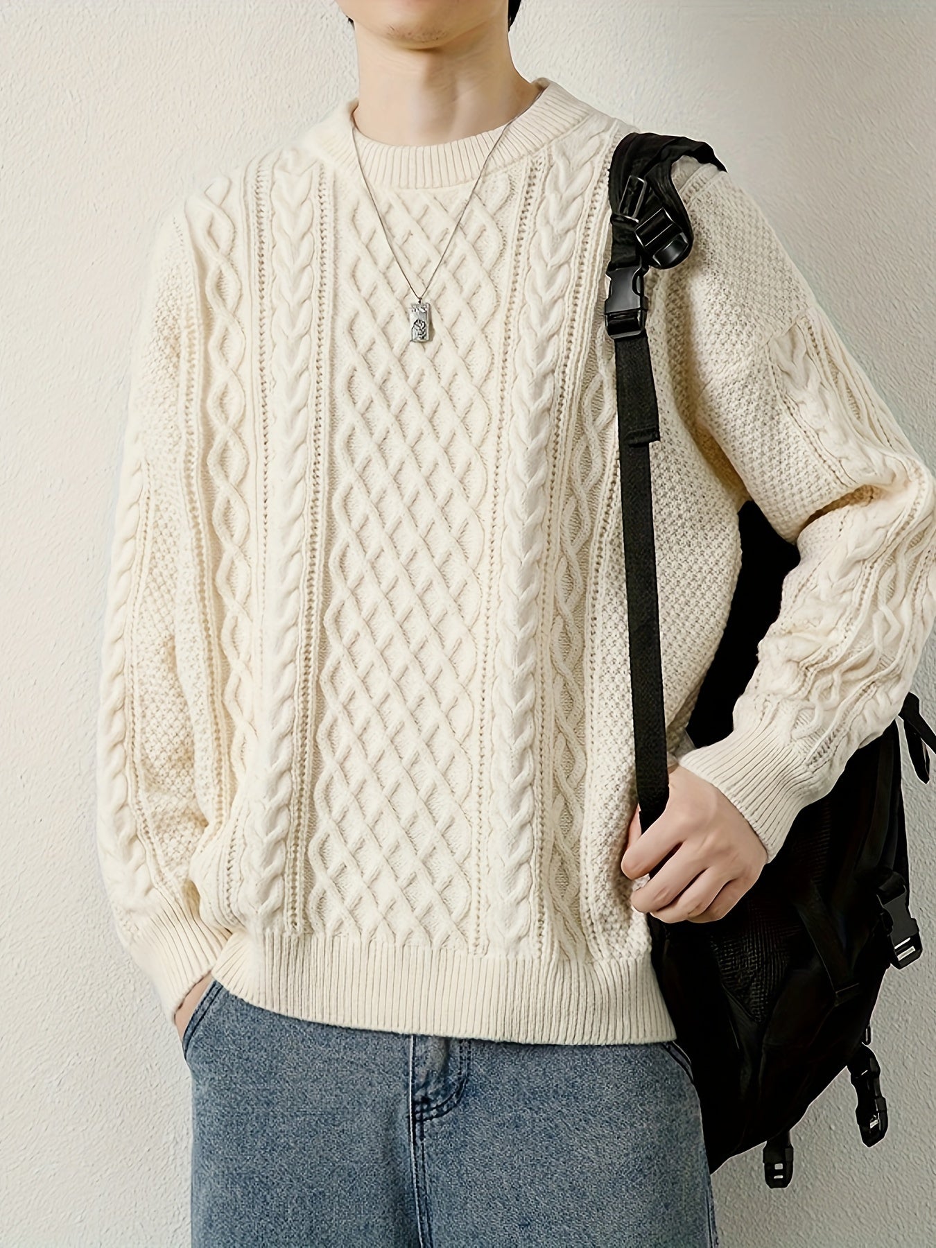 Warm men's cable knit pullover sweater, essential for winter comfort.