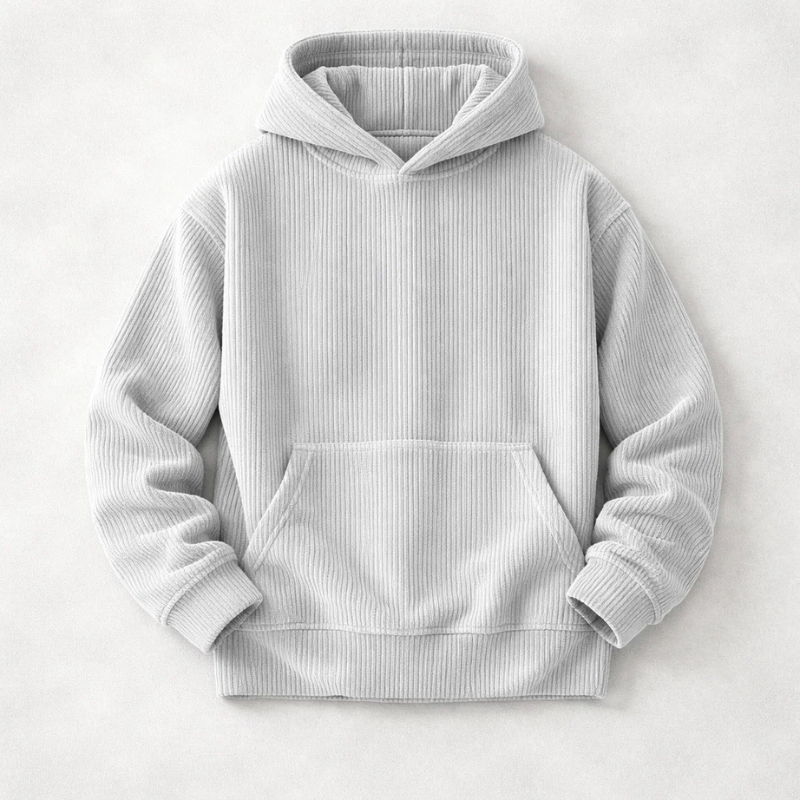 Close-up of soft, cozy fabric on a men's relaxed fit pullover hoodie, ensuring everyday comfort & warmth.