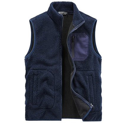 Man wearing a Cozy Ridge sherpa fleece vest over a long-sleeve, showcasing versatile layering.