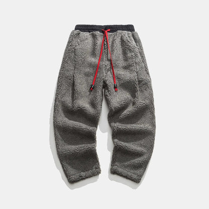 Warm men's sherpa winterwear sweatpants, offering supreme coziness and a stylish look for cold days.