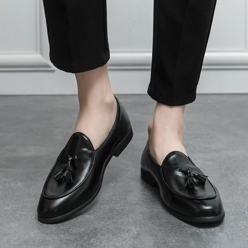 Polished leather men's tassel loafers, offering a sophisticated look for dressy or smart casual outfits.