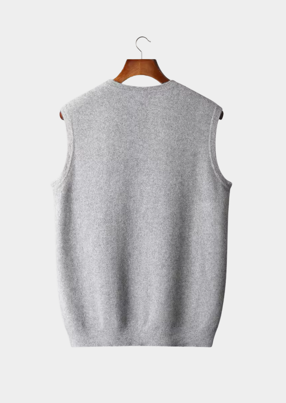 Sleek men's crew neck vest in minimalist style, perfect as a layering top for spring and summer fashion. Casual wear.