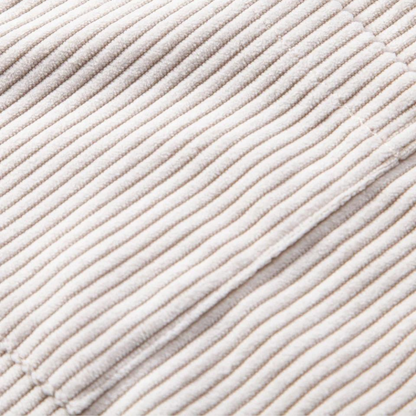 Close-up of a men's short-sleeve Cuban collar shirt, highlighting the soft texture of the corduroy fabric.