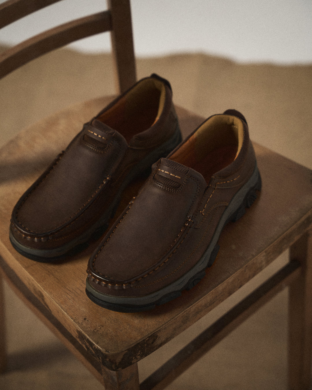 Side view of Men's Dakota brown slip-on loafers, showcasing durable design for casual everyday comfort.