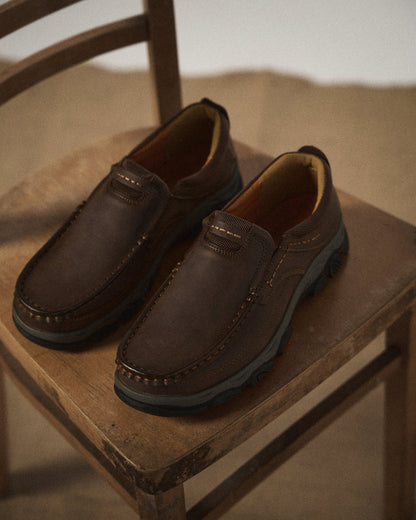 Side view of Men's Dakota brown slip-on loafers, showcasing durable design for casual everyday comfort.
