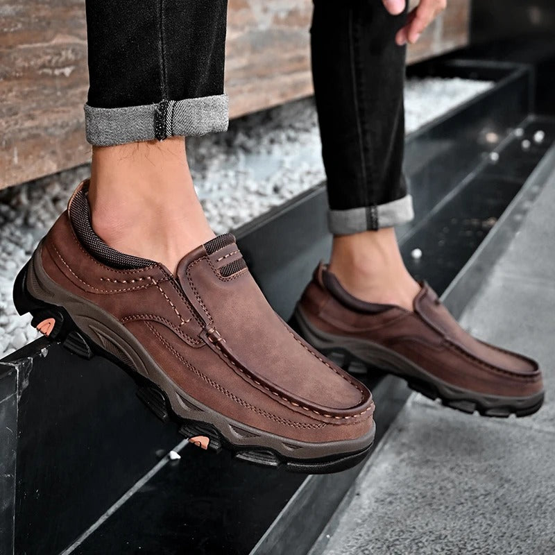 Man wearing comfortable brown Dakota slip-on loafers, ideal for durable casual everyday style.