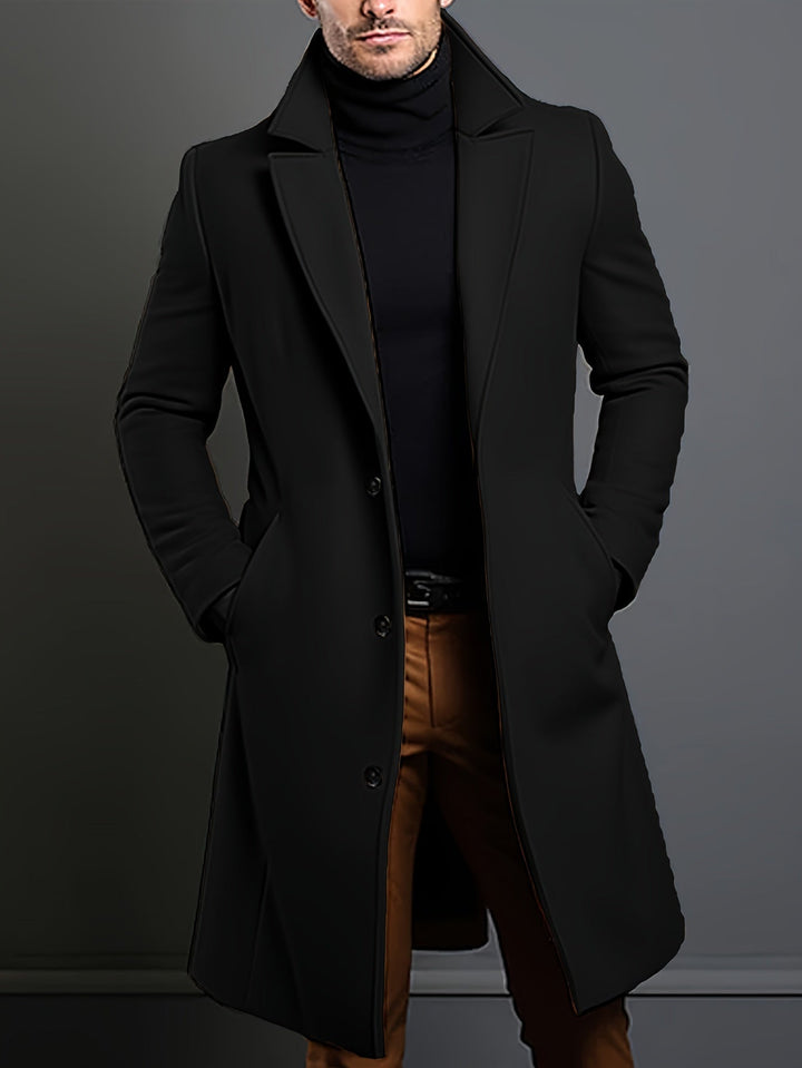 Men's business casual dark blue single-breasted overcoat. Long lapel coat for winter outerwear.