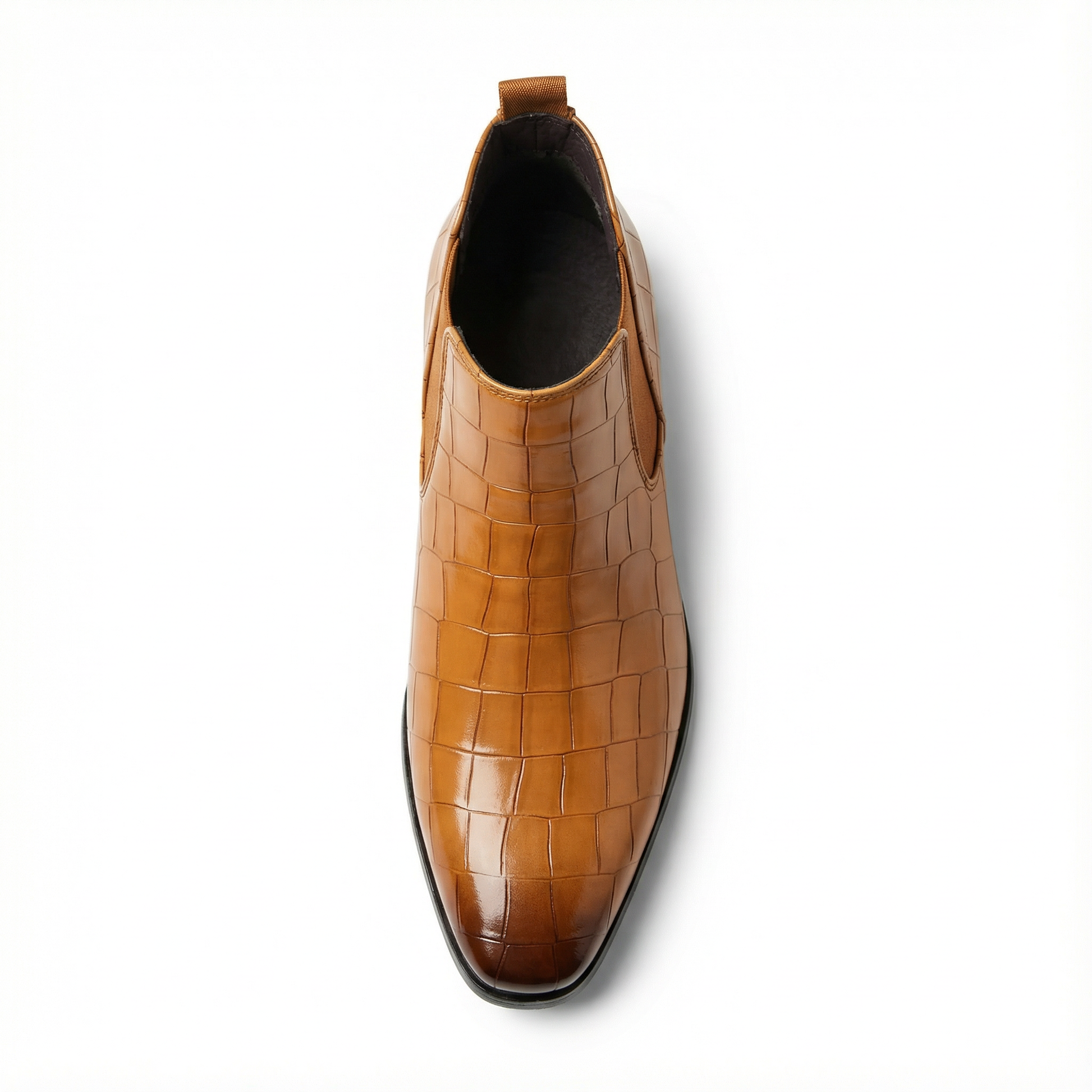 Side view of sleek dark brown leather Chelsea boots, showcasing elastic goring & polished finish.
