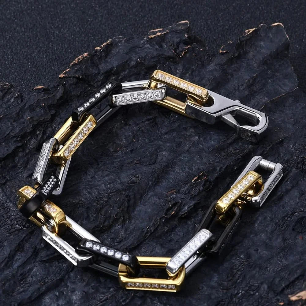 Sparkling men's gold chainlink bracelet with dazzling zirconia, a luxurious & durable statement piece.