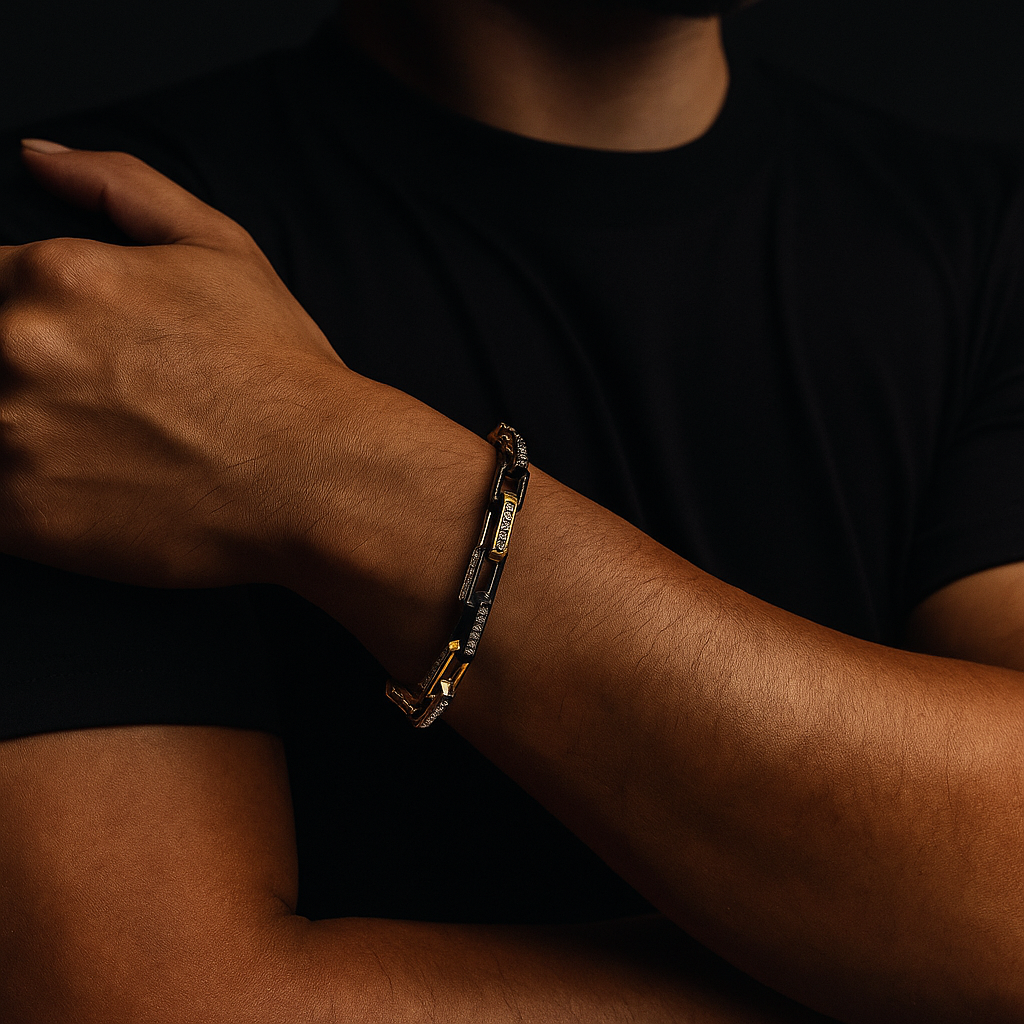 Close-up: Sparkling zirconia stones on a durable men's gold chainlink bracelet made of stainless steel.