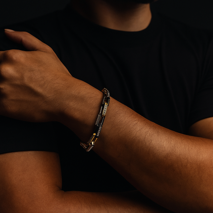 Close-up: Sparkling zirconia stones on a durable men's gold chainlink bracelet made of stainless steel.