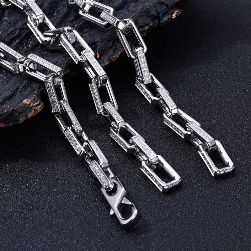 Durable men's chainlink bracelet crafted from stainless steel with a gold finish & sparkling zirconia.