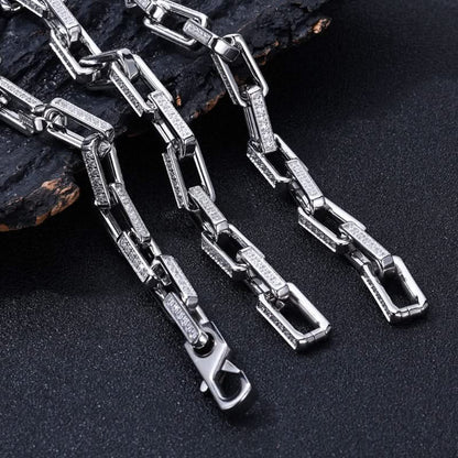 Durable men's chainlink bracelet crafted from stainless steel with a gold finish & sparkling zirconia.