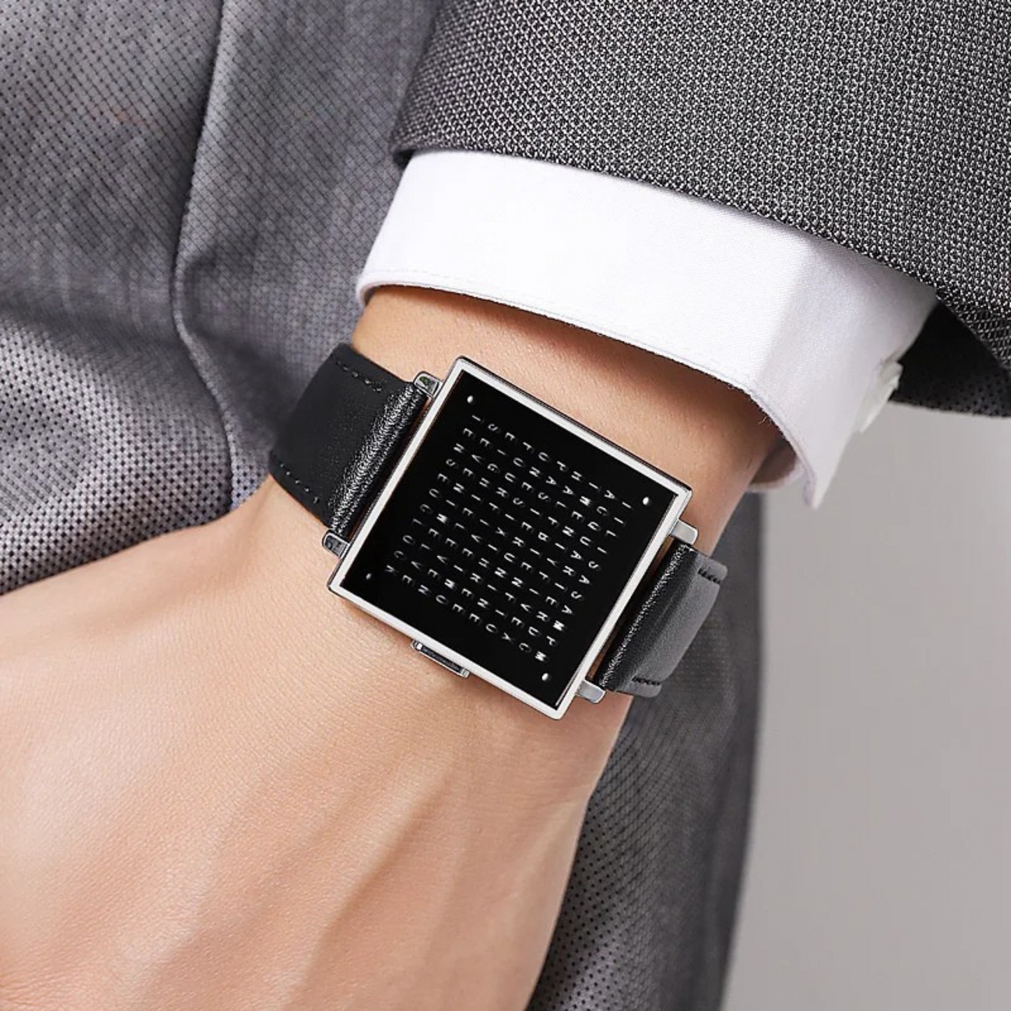 Front view of a men's square face digital LED watch with a black leather strap, showcasing the display.