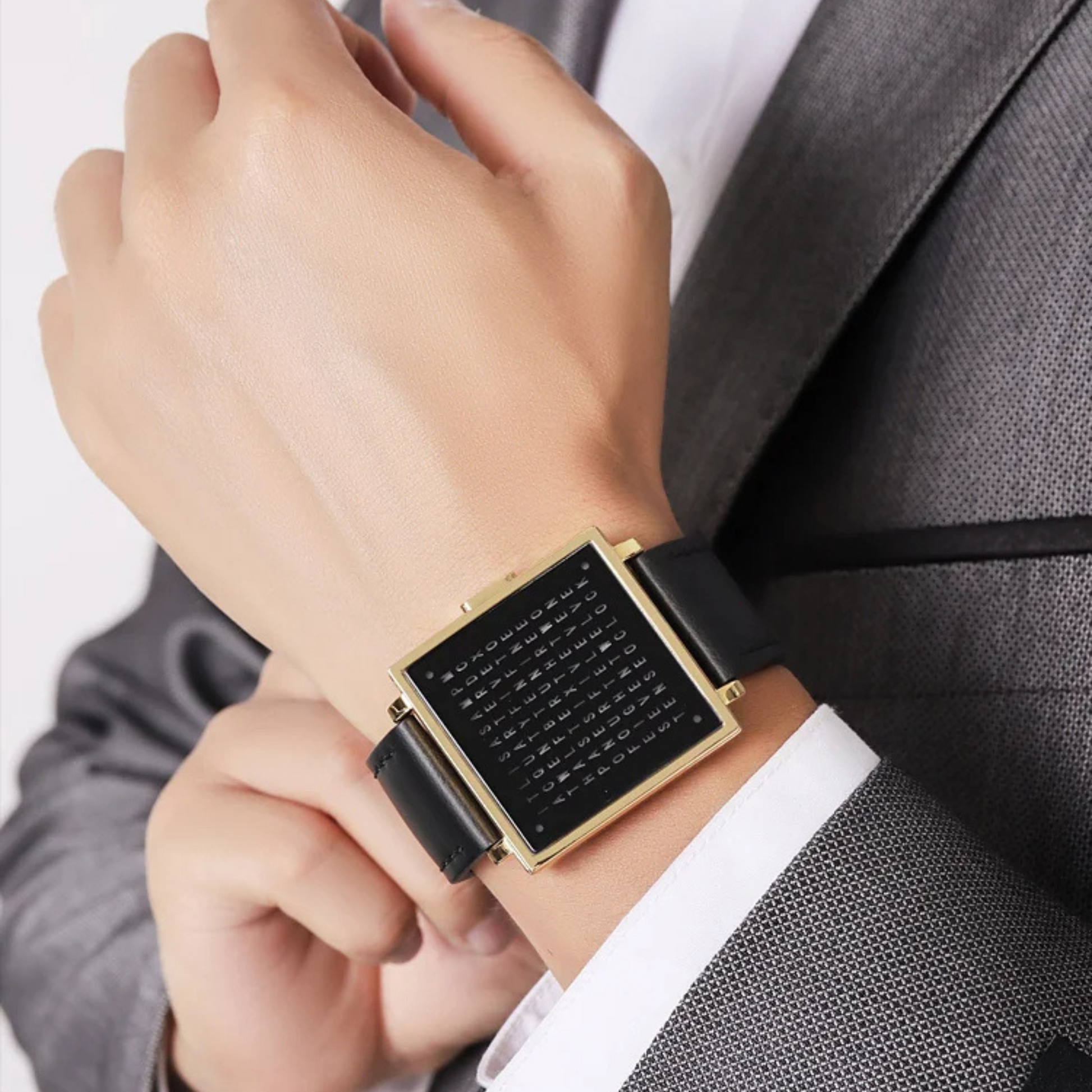 Black men's digital watch featuring a vibrant LED display & comfortable leather strap. Square face.