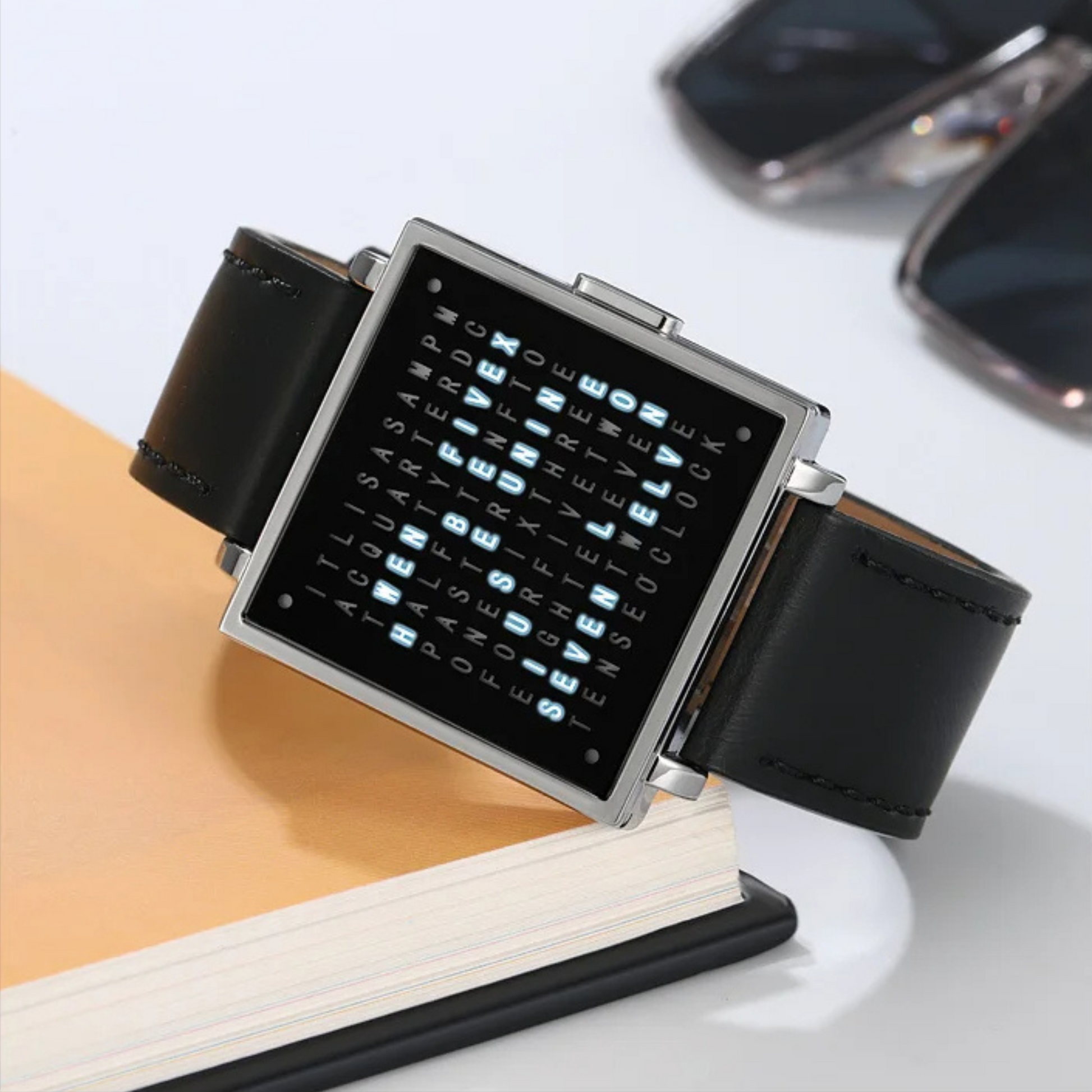 Detailed view of the genuine leather strap and modern square face of a men's digital LED watch.