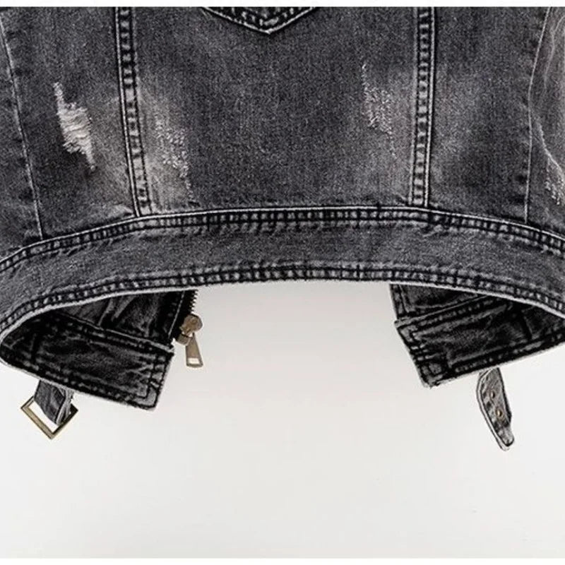 Vintage wash men's distressed denim vest with asymmetric zip, belted hem, and edgy fashion details.