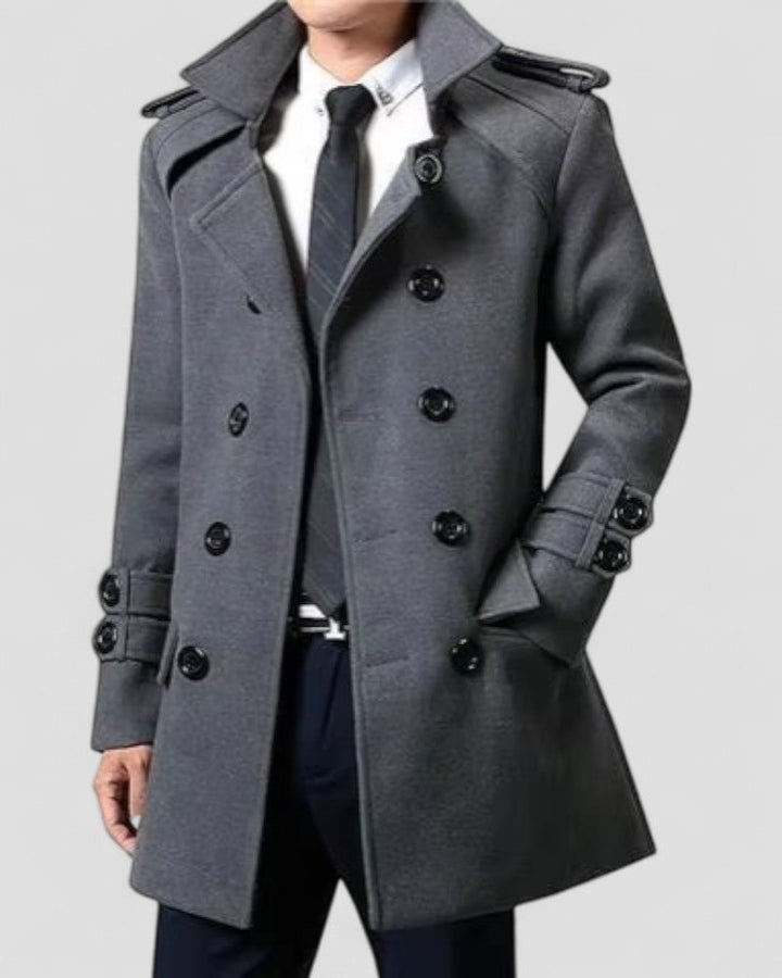 Stylish men's black trench coat featuring an elegant double-breasted design for sharp fall & winter fashion.