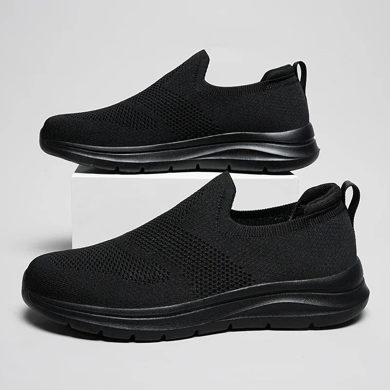 Breathable knit texture of men's DriftWalk slip-on walking shoes, lightweight design.