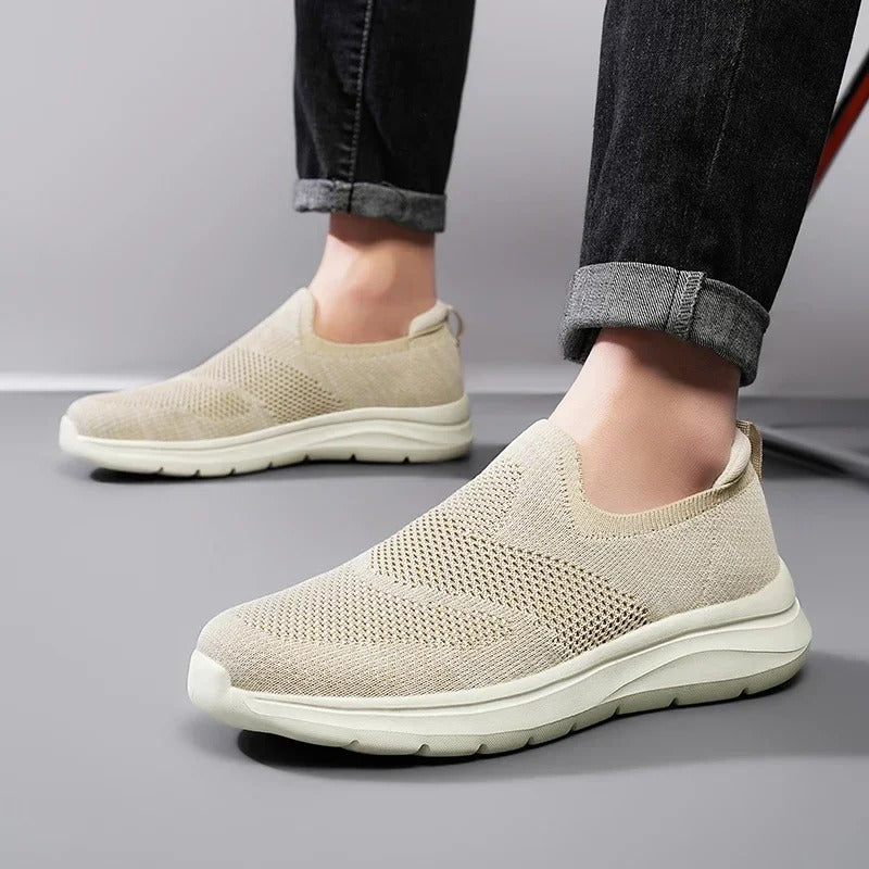 Light grey men's DriftWalk knit slip-on walking shoes, breathable, lightweight & casual.