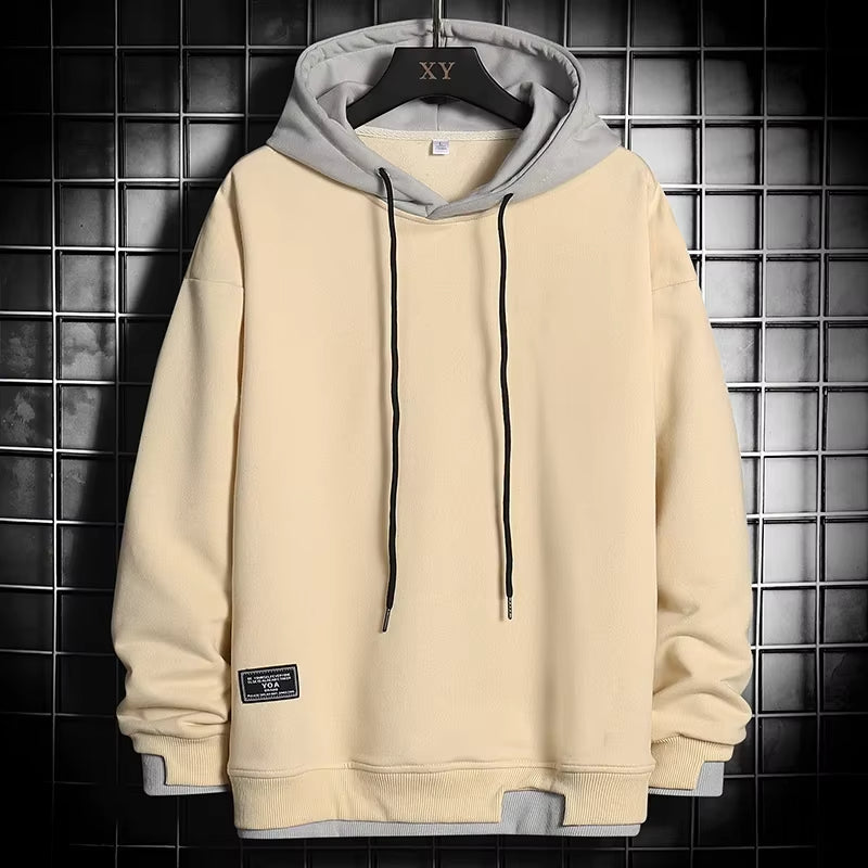 Comfortable men's pullover hoodie, dual-tone design with a stylish layered hem, versatile fashion.
