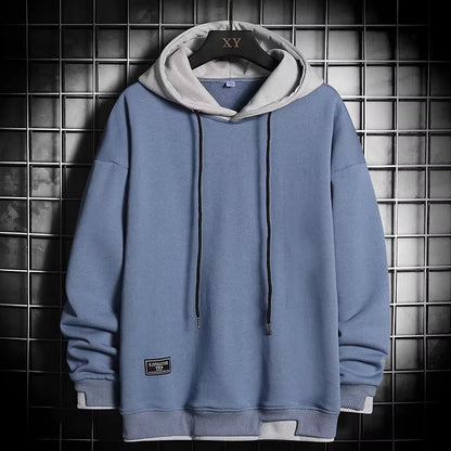Men's dual-tone hoodie featuring a stylish layered hem, offering modern comfort and a unique casual look.
