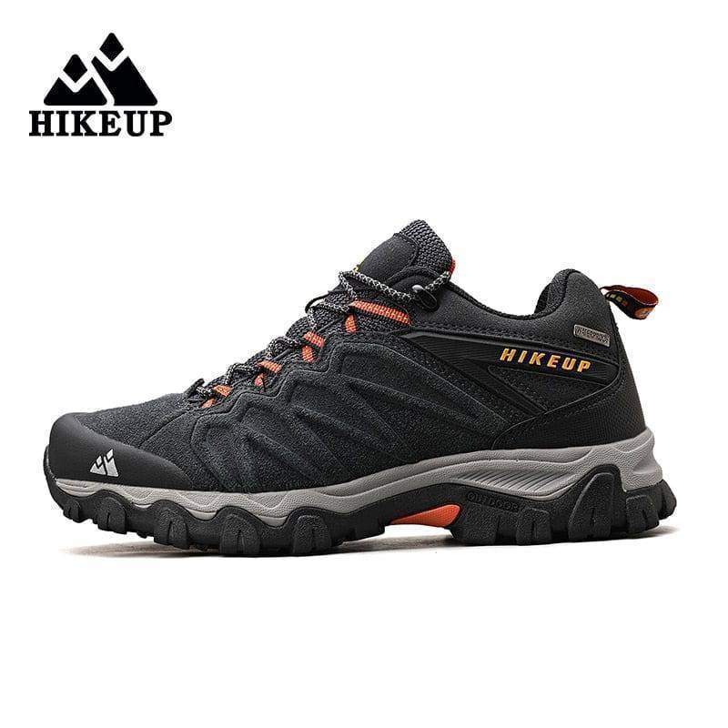 Close-up of men's leather trekking footwear, highlighting durable stitching and metal eyelets