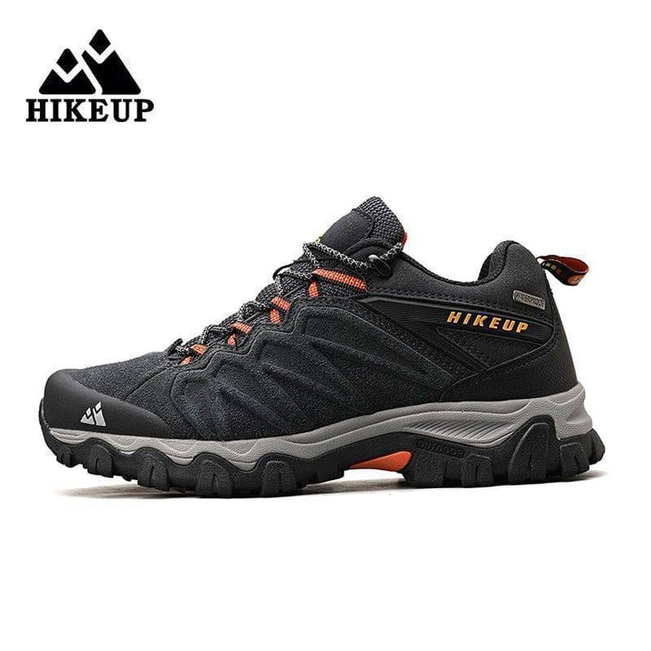 Close-up of men's leather trekking footwear, highlighting durable stitching and metal eyelets