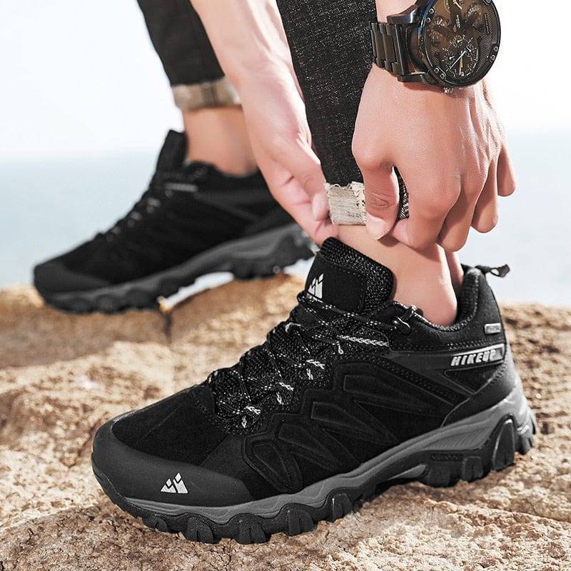 Men's brown leather hiking boots, designed for comfort and breathability during long treks