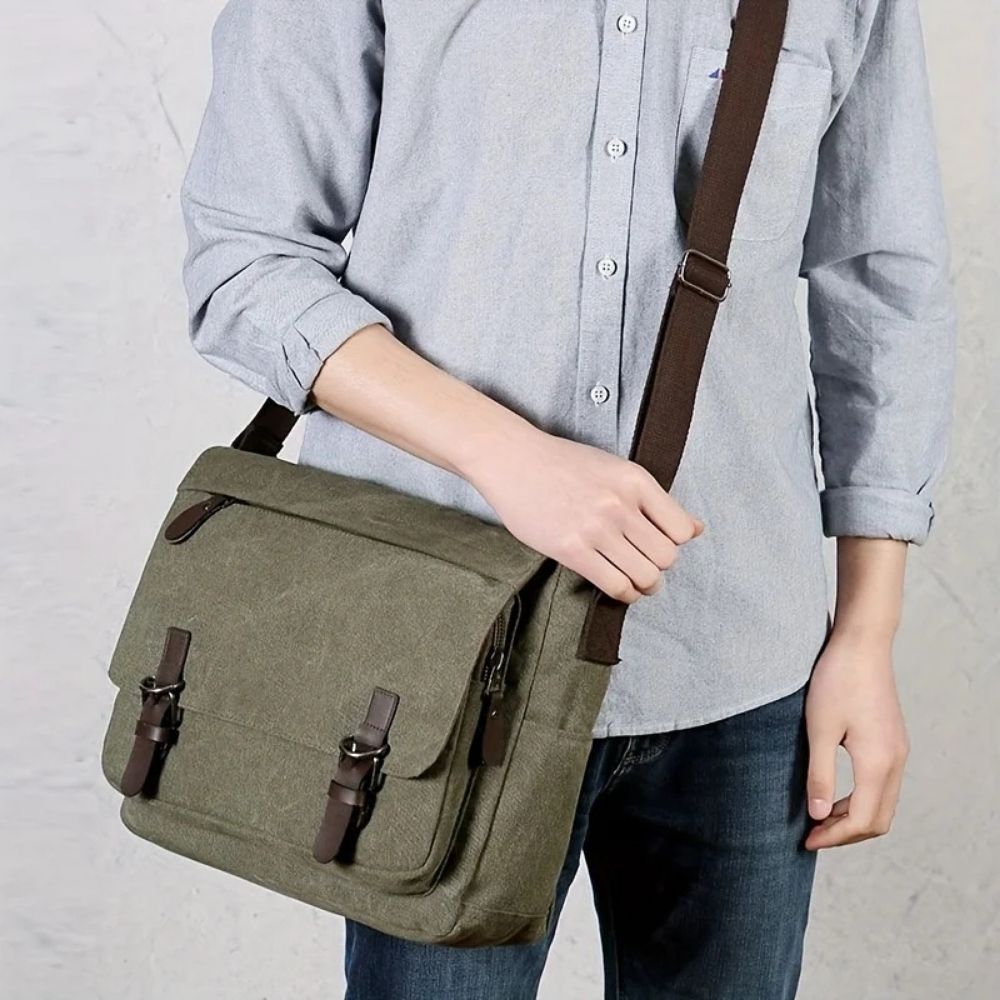 Vintage style men's canvas shoulder bag. Rugged messenger satchel for laptops & daily commute.