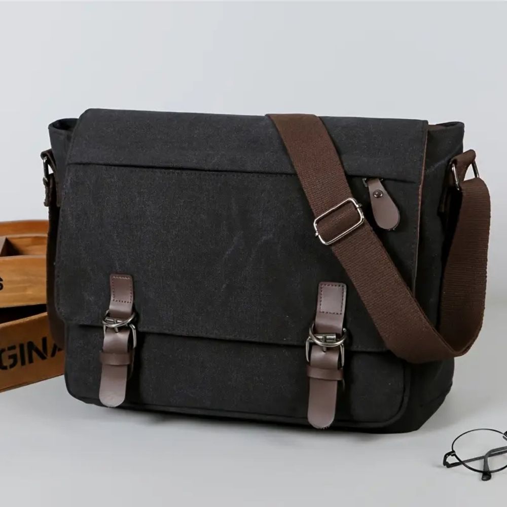 Heavy-duty men's canvas messenger bag. Versatile satchel for laptops, school, or daily adventures.
