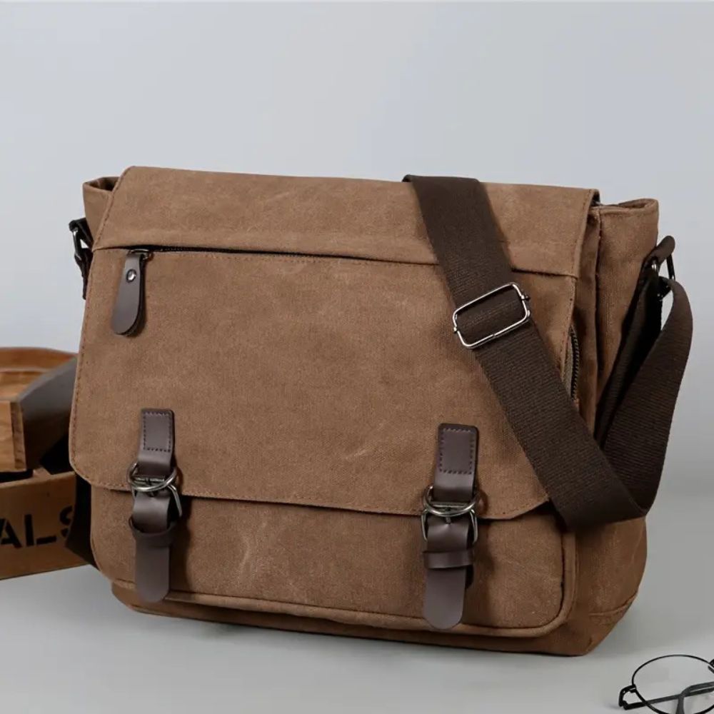 Rugged men's canvas laptop bag. Durable messenger satchel, great for commuters & travelers.