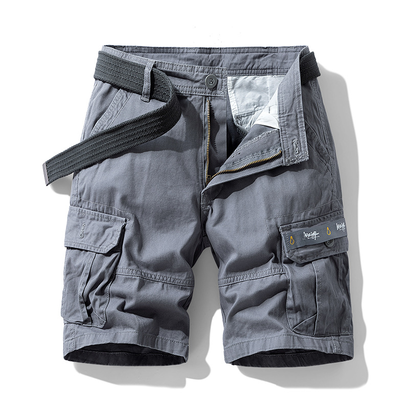 Close-up of durable fabric on men's utility cargo shorts, showcasing quality for adventure & daily wear.
