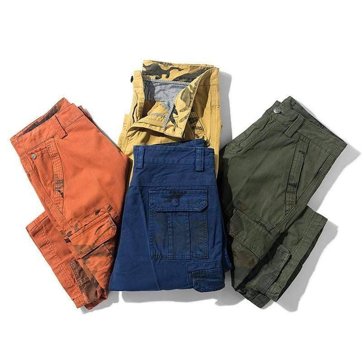 Men's durable cotton cargo shorts in olive green, ideal for hiking & outdoor activities.