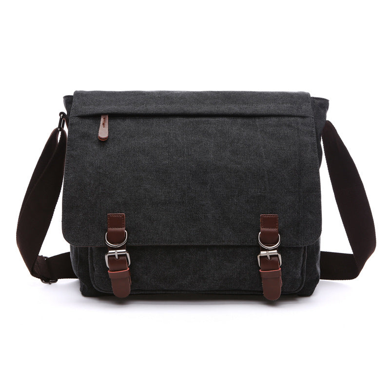 Rugged men's travel messenger bag, durable construction & secure buckle straps for adventures.