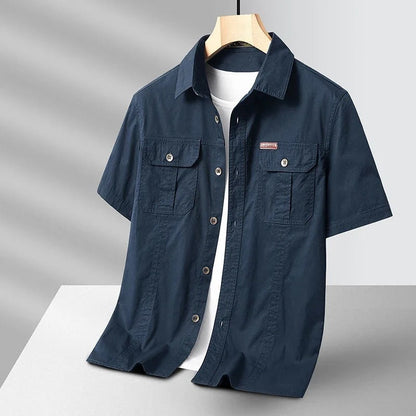 Navy blue men's durable short sleeve cotton work shirt, a utility essential for any man.