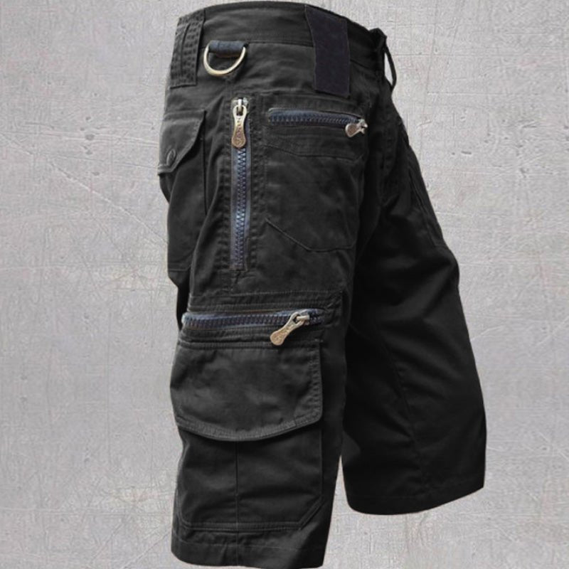 Durable men's multi-pocket cargo shorts, practical for outdoor adventures & travel. Relaxed fit ensures comfort.
