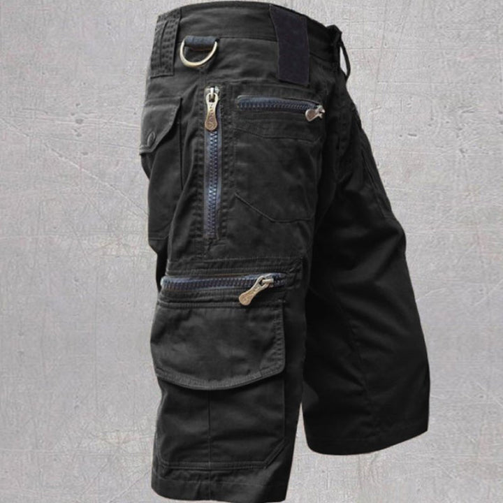 Durable men's multi-pocket cargo shorts, practical for outdoor adventures & travel. Relaxed fit ensures comfort.