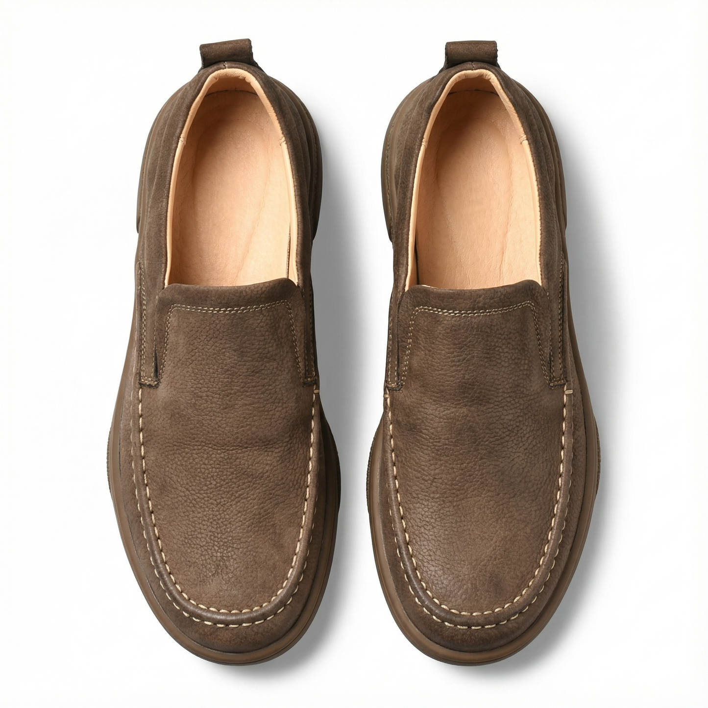Casual men's moc-toe slip-on loafers, providing durable and comfortable footwear.