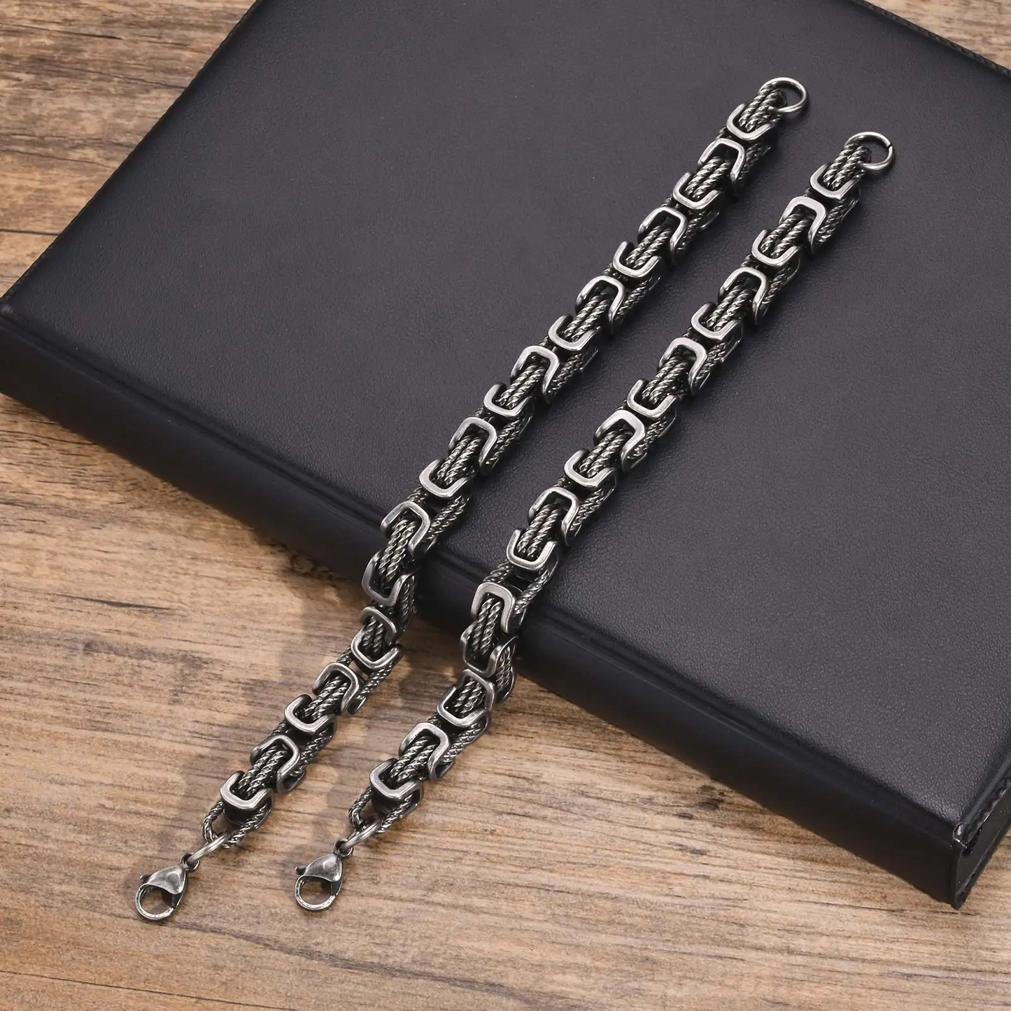 Polished stainless steel chain bracelet for men, durable and rugged accessory for any style.